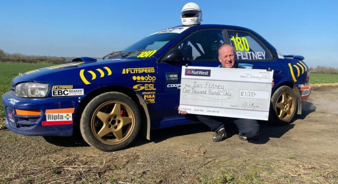 Ian Flitney receiving his winning cheque