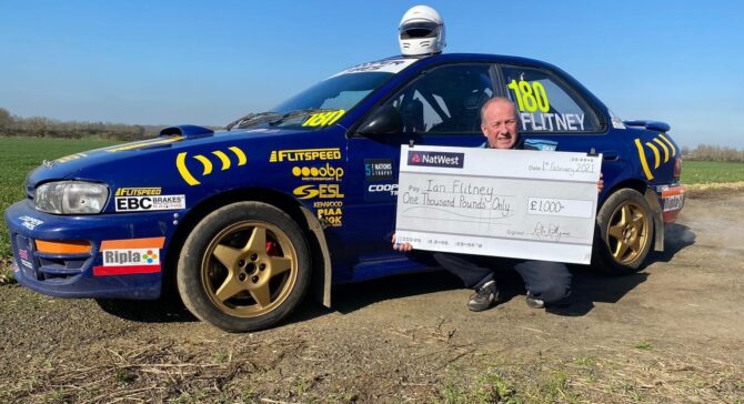 Ian Flitney receiving his winning cheque